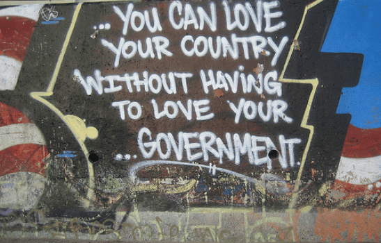 Graffiti with a quote saying You can love your country without having to love your government