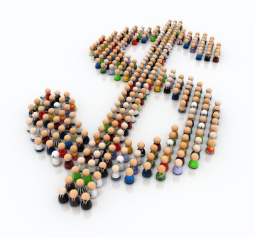 Peg dolls of different people grouped together to form a dollar sign