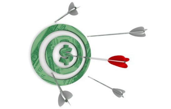 Target with a dollar sign in the middle with four white dart pins missing the target and a red dart pin hitting the bulls eye