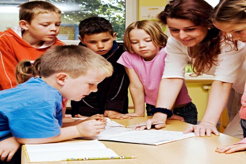children learning from a teacher